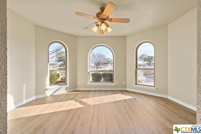 6503 Wells Fargo Rd, Killeen, TX 76542 - empty room with wood finished floors, baseboards, and ceiling fan