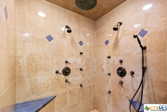 bathroom with a tile shower