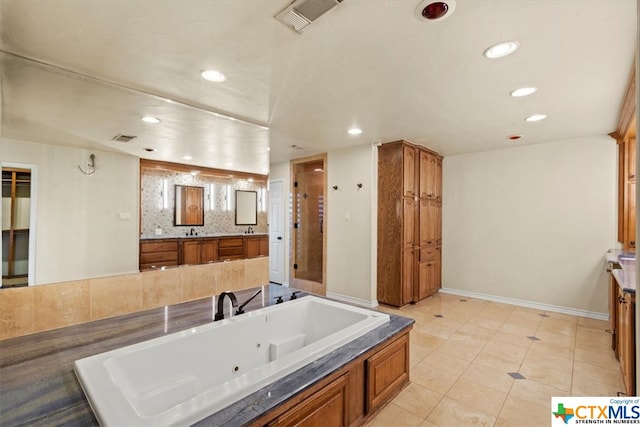 bathroom with shower with separate bathtub, vanity, tile patterned flooring, and tasteful backsplash