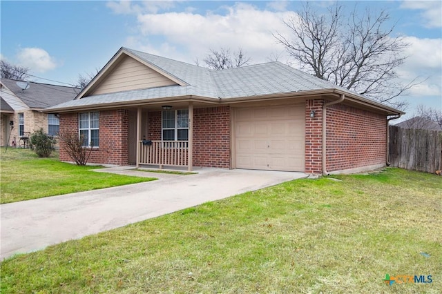 single story home featuring a garage and a front yard