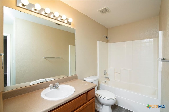 full bathroom featuring vanity, toilet, and shower / bath combination