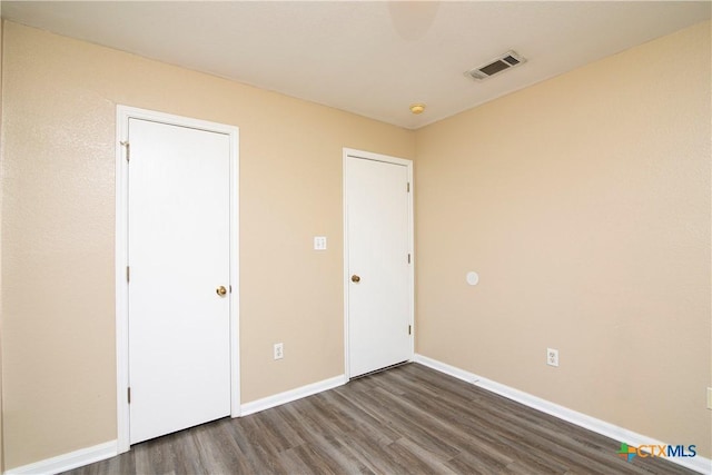 unfurnished bedroom with wood-type flooring