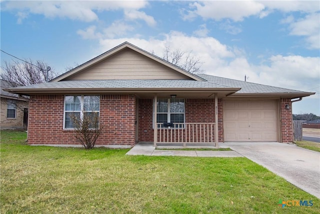 view of front of house with a garage, a front yard, and a porch