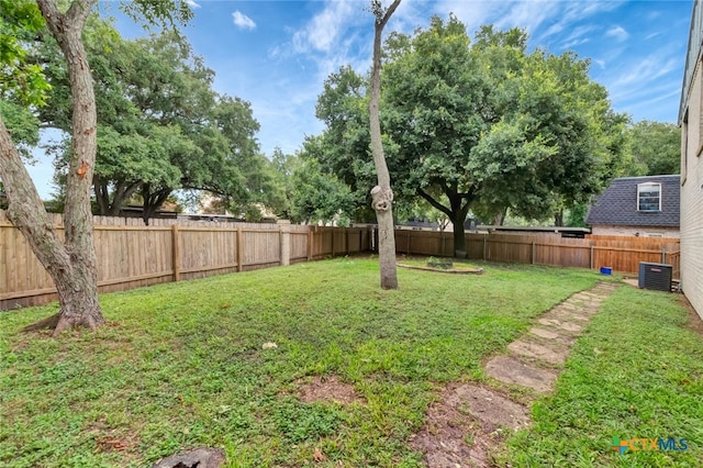 view of yard featuring central AC unit