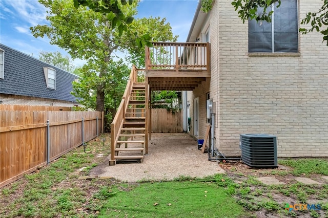 exterior space with a deck and cooling unit