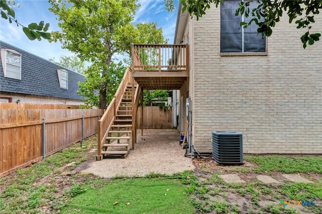 exterior space featuring a wooden deck and central air condition unit