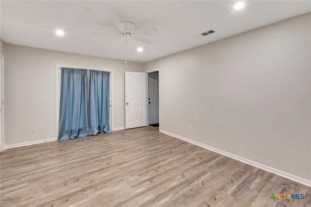 unfurnished bedroom featuring light wood-type flooring and ceiling fan