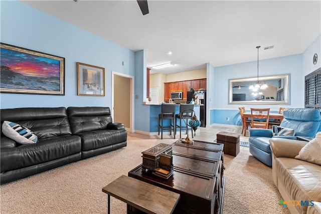 3516 Valley Mist Ct, Temple, TX 76502 - living room with light carpet, a chandelier, a ceiling fan, and baseboards