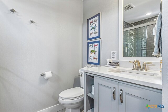37 Flamingo Rd, Rockport, TX 78382 - full bathroom with vanity, toilet, tiled shower, and baseboards