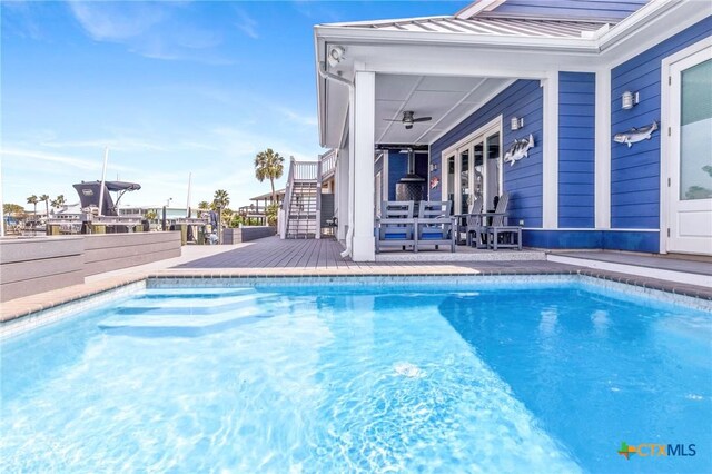 37 Flamingo Rd, Rockport, TX 78382 - swimming pool with stairs and a wooden deck