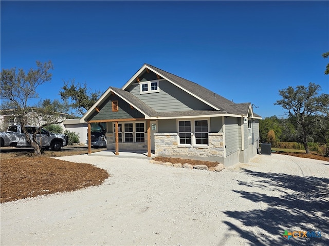 view of front of house featuring cooling unit