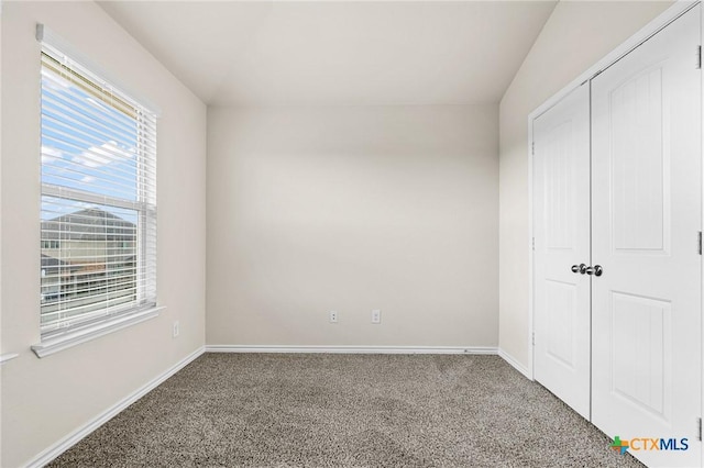 5101 Hacienda Dr, Killeen, TX 76549 - unfurnished bedroom with carpet floors, baseboards, and a closet