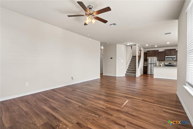 5101 Hacienda Dr, Killeen, TX 76549 - unfurnished living room with a ceiling fan, stairway, dark wood finished floors, baseboards, and recessed lighting