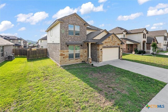 5101 Hacienda Dr, Killeen, TX 76549 - view of front of house featuring a residential view, driveway, an attached garage, central AC, and stone siding