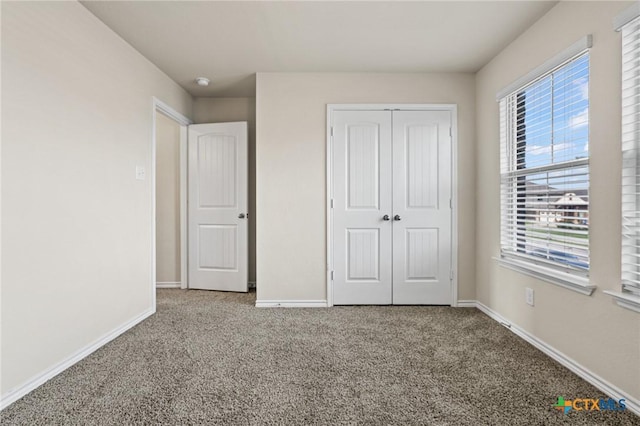 5101 Hacienda Dr, Killeen, TX 76549 - unfurnished bedroom with carpet flooring, baseboards, and a closet