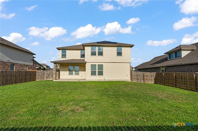 5101 Hacienda Dr, Killeen, TX 76549 - back of property featuring roof mounted solar panels and a patio area