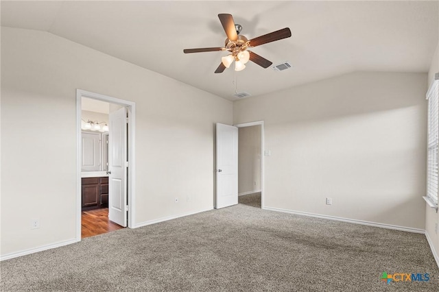 5101 Hacienda Dr, Killeen, TX 76549 - unfurnished bedroom with carpet flooring, lofted ceiling, baseboards, ensuite bathroom, and ceiling fan