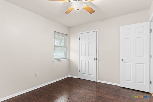 2004 Veterans Ave, Copperas Cove, TX 76522 - unfurnished bedroom with dark wood finished floors, baseboards, and a ceiling fan