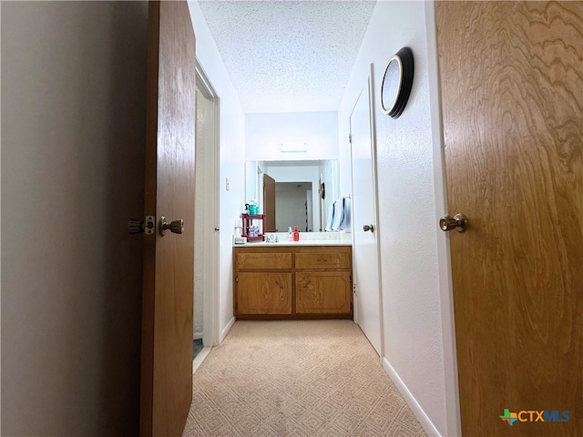 1901 Muir Dr, Killeen, TX 76543 - corridor featuring a textured ceiling and baseboards