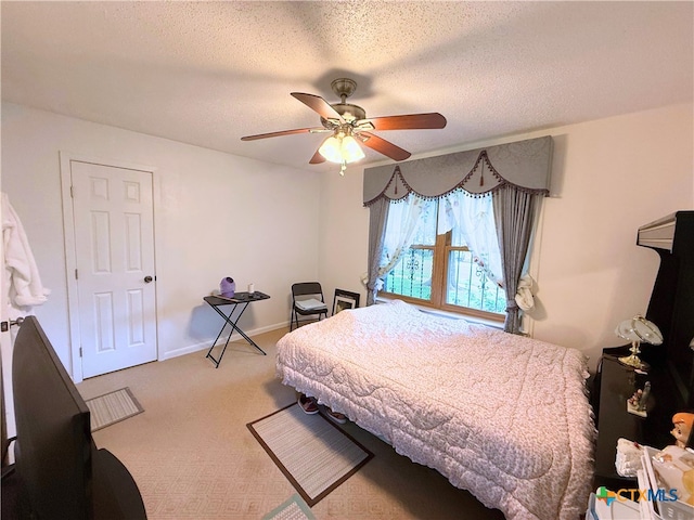 1901 Muir Dr, Killeen, TX 76543 - carpeted bedroom with a textured ceiling and ceiling fan