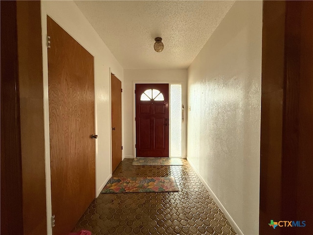 1901 Muir Dr, Killeen, TX 76543 - entryway with a textured ceiling and baseboards