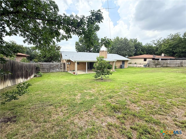 1901 Muir Dr, Killeen, TX 76543 - fenced backyard featuring a patio area