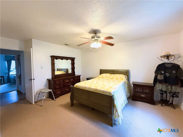 1901 Muir Dr, Killeen, TX 76543 - bedroom featuring light colored carpet, a textured ceiling, and ceiling fan