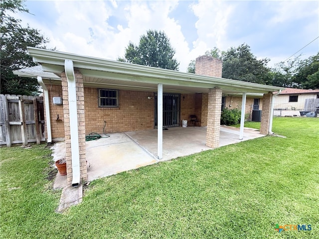 1901 Muir Dr, Killeen, TX 76543 - back of house featuring a chimney, a patio area, and brick siding