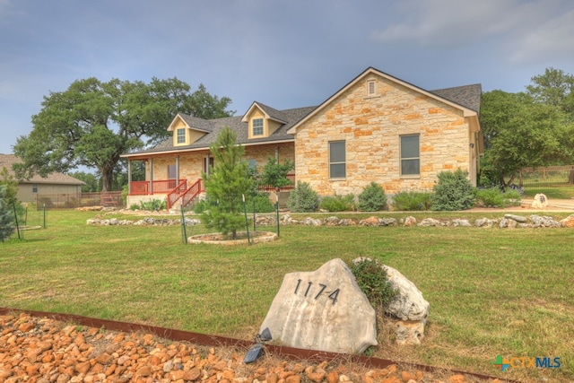 view of front of home with a front lawn