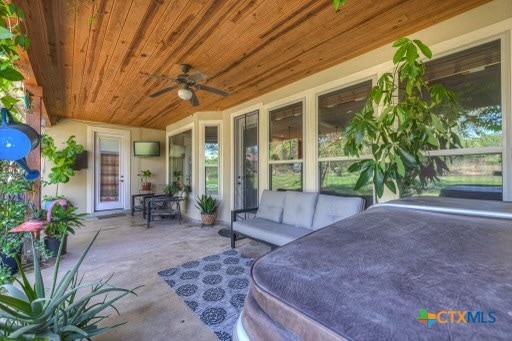 view of patio with ceiling fan