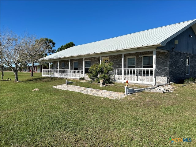 back of house featuring a porch and a yard