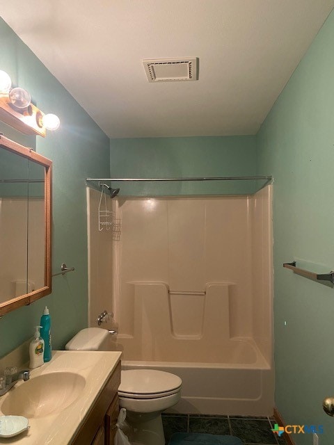 full bathroom featuring tile patterned flooring, toilet, shower / bath combination, vanity, and visible vents