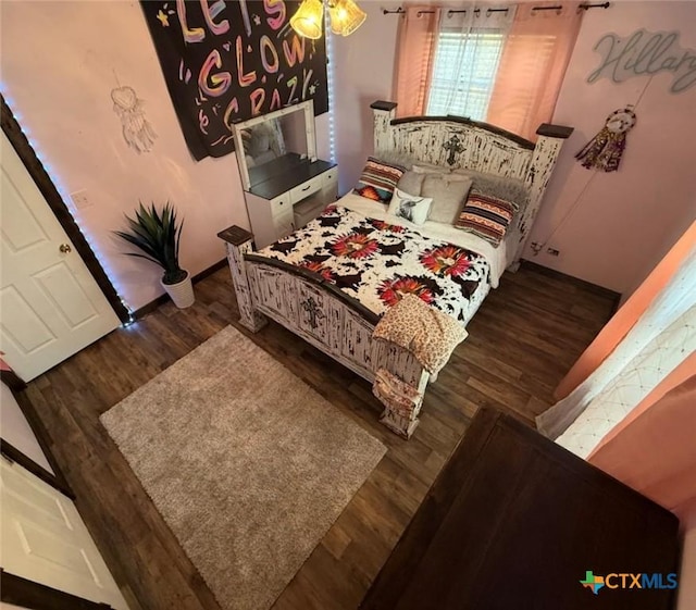 202 Clark St, Yoakum, TX 77995 - bedroom with wood finished floors