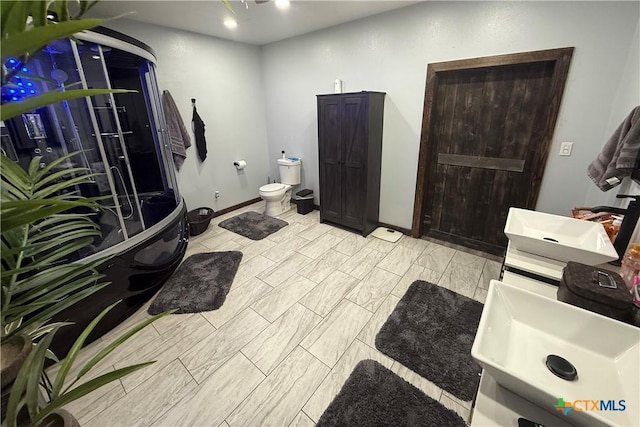 202 Clark St, Yoakum, TX 77995 - full bath with toilet and baseboards