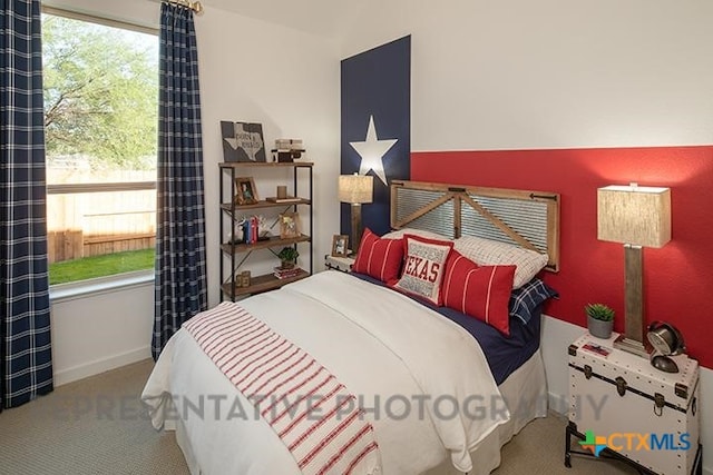 bedroom featuring carpet floors, baseboards, and lofted ceiling