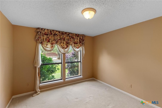 2820 Aurora, Horseshoe Bay, TX 78657 - unfurnished room featuring carpet floors and a textured ceiling