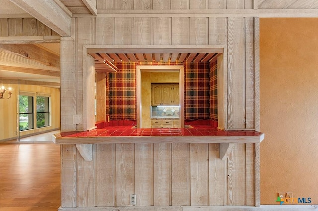 2820 Aurora, Horseshoe Bay, TX 78657 - detailed view of bar area, wood finished floors, and a chandelier