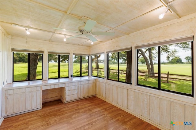 2820 Aurora, Horseshoe Bay, TX 78657 - unfurnished sunroom with plenty of natural light, built in desk, a ceiling fan, wood finished floors, and wood ceiling
