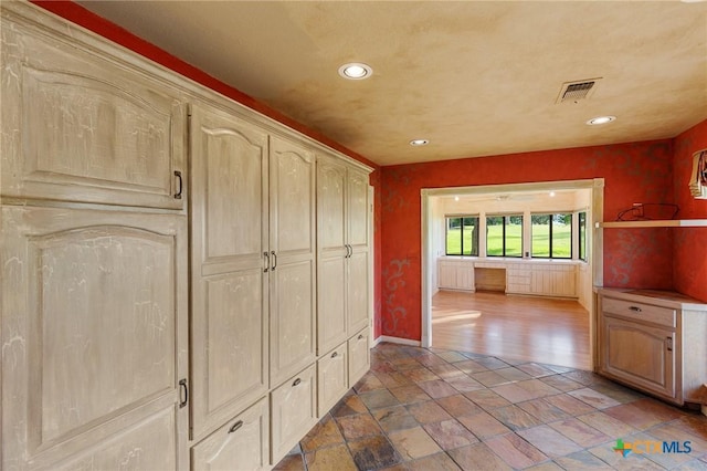 2820 Aurora, Horseshoe Bay, TX 78657 - hall with recessed lighting and stone tile flooring