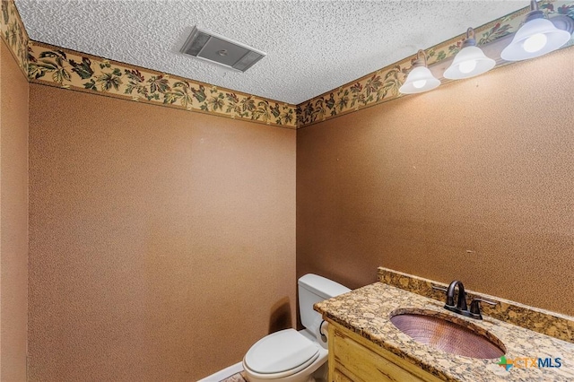 2820 Aurora, Horseshoe Bay, TX 78657 - bathroom featuring a textured ceiling and vanity