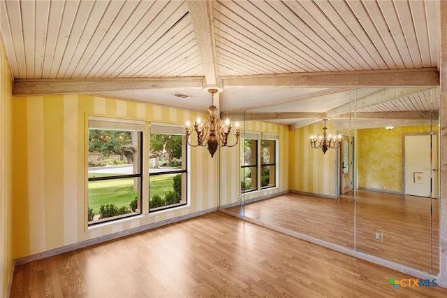 2820 Aurora, Horseshoe Bay, TX 78657 - unfurnished dining area featuring a chandelier, wood finished floors, and a wood ceiling with exposed beams