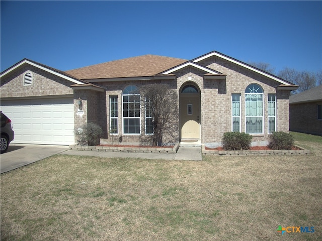 ranch-style house featuring concrete driveway, a front yard, brick siding, and a garage