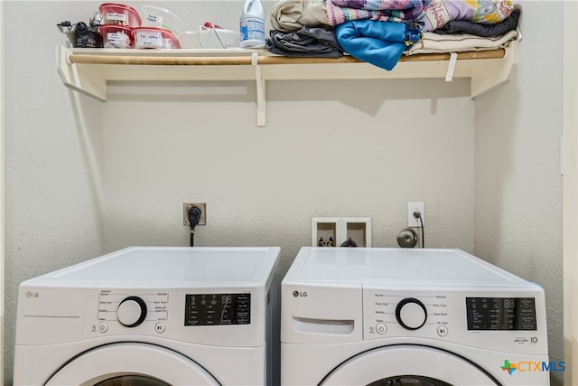 laundry room with separate washer and dryer