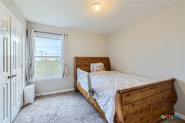 bedroom featuring carpet floors and a closet