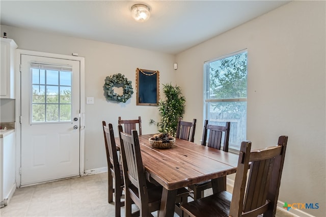 dining space featuring plenty of natural light