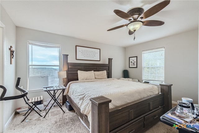 bedroom featuring ceiling fan and light carpet