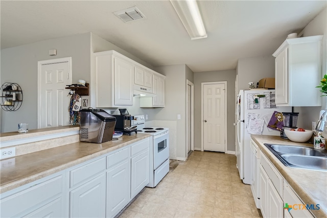 kitchen with white cabinets, white appliances, and sink