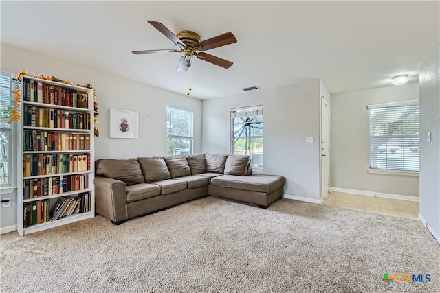 carpeted living room featuring ceiling fan