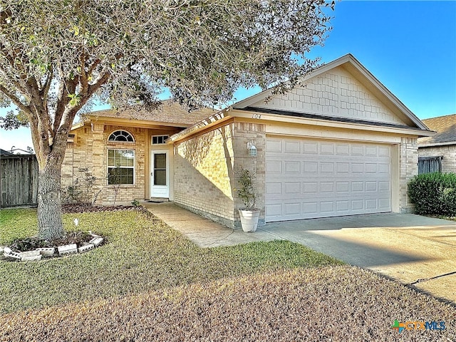 view of front of home featuring a front lawn and a garage