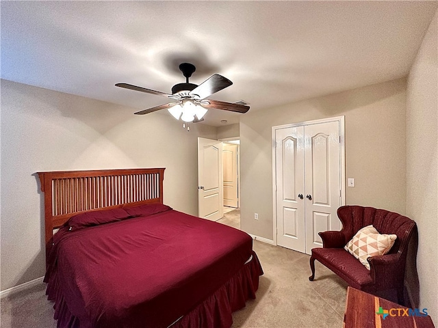 carpeted bedroom with a closet and ceiling fan